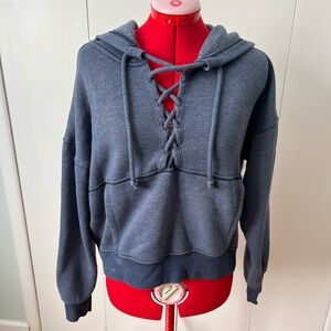 FP Movement by Free People V-Neck Lace-Up Sweater in Dark Gray